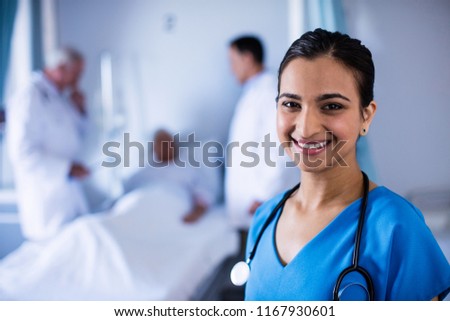 Portrait of female doctor smiling in the ward at hospital