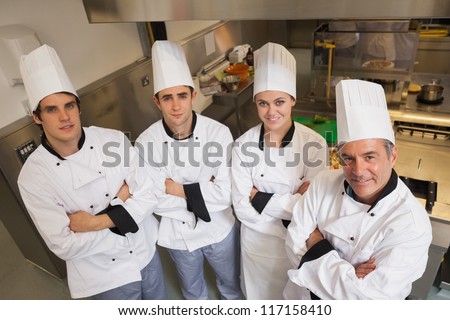 Team of Chef\'s standing in kitchen