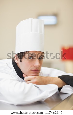 Thoughtful chef in the kitchen