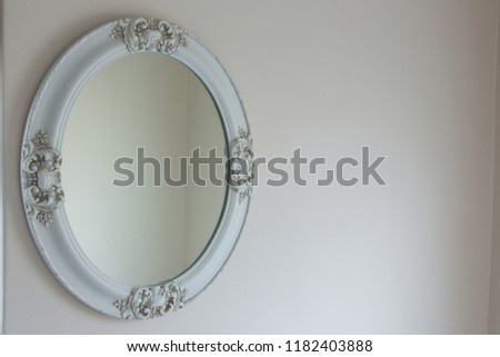 White mirror on white wall at home