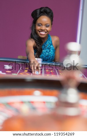 Woman playing roulette at a casino