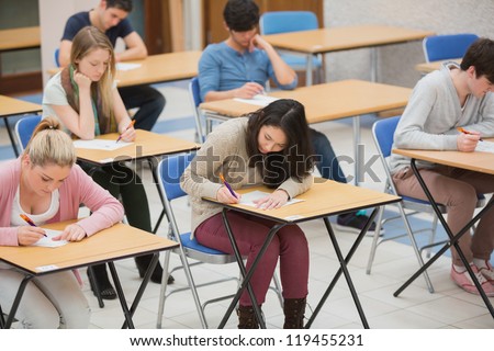 Students Writing In The Exam Hall Of The College