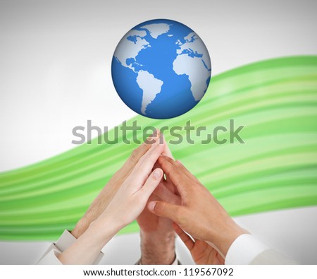 People reaching hands up to a globe against white background with green wave