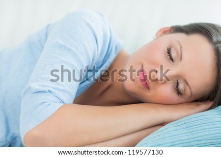 Peaceful woman sleeping on the couch