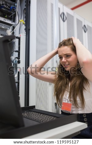 Woman stressing over the servers in data center