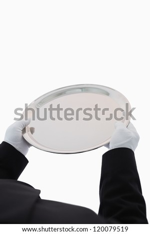 Large silver tray being held out on white background