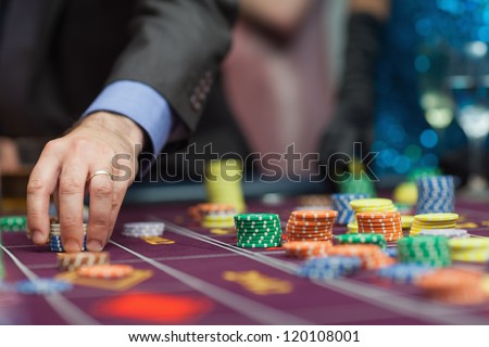 Man placing a bet at the casino