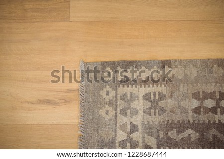 Overhead view of floor mat on wooden floor at home