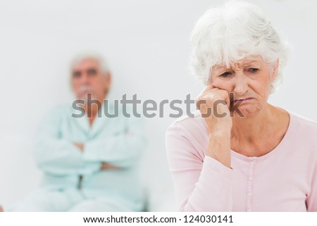 Elderly couple having a dispute in bedroom