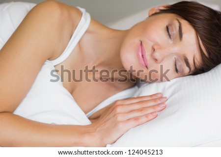 Pretty woman asleep in bed