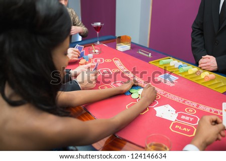 Woman winning at poker in casino