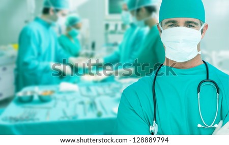 Surgeon standing with his arms crossed