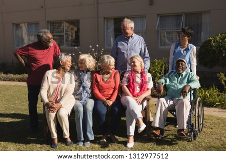 Front view of active and diverse group of senior people interacting with each other in the park
