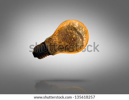 Digital circuit inside orange light bulb against grey background