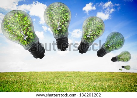 Light bulbs floating with plants inside