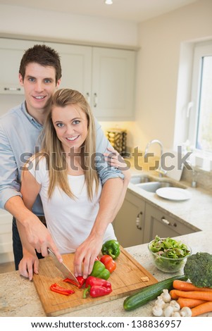 Young couple working in the kitchen