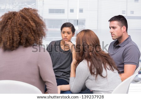 Patients listening to another patient during therapy session
