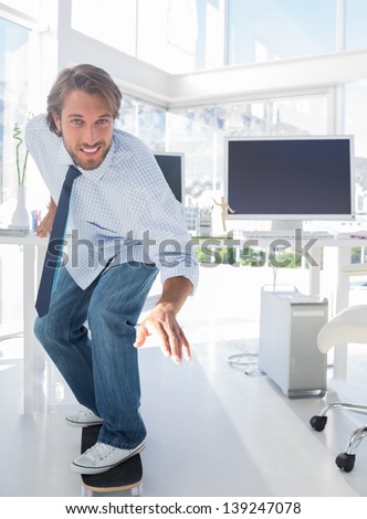 Employee skating through his office in a shirt and tie