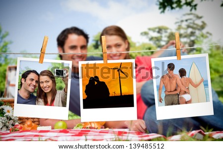 Serial instant photos of holiday scenes hung with a peg on a laundry line with couple having a picnic on the background