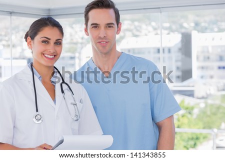 Smiling medical staff standing together
