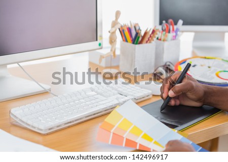 Designer using a graphics tablet in a modern office