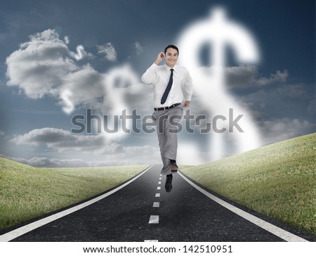 Dollar currency behind businessman running on a road with cloudy sky on the background