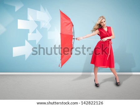 Glamour woman holding a broken umbrella