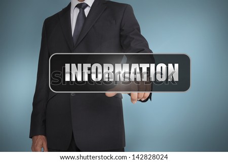 Businessman touching the word information written on black tag on blue background