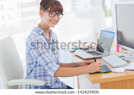 Pretty Brunette Designer Working On Her Graphics Tablet