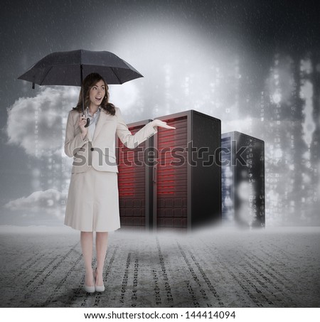 Businesswoman in front of servers holding umbrella and smiling