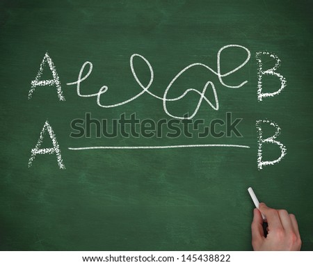 Hand connecting the letter A to the letter B on chalkboard