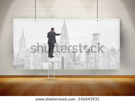 Businessman standing on ladder and drawing a city on a poster hung and exhibited like art