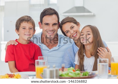 Portrait Of A Cute Family At The Table