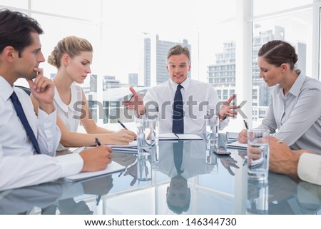 Businessman gesturing during a meeting as he looks angry
