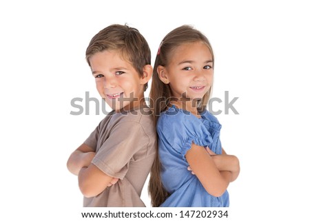 Children standing back to back with arms crossed on white background