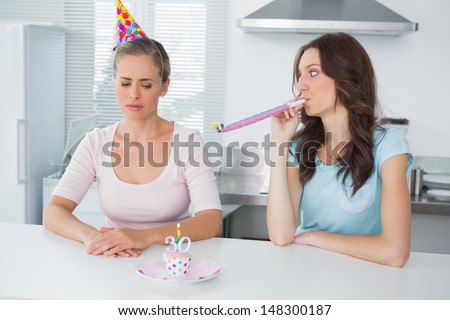 Woman In The Kitchen Cheering Up Her Upset Friend On Her 30th Birthday