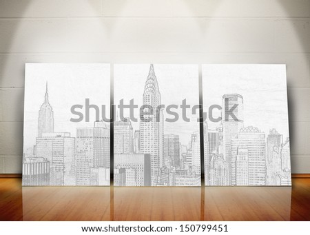 Three posters representing a big city standing in line against a wall