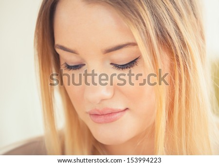 Attractive blonde woman looking down