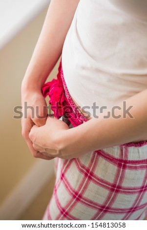 Girl crossing her hands above her pajama