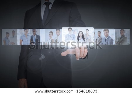 Businessman showing digital interface of business people