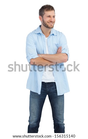 Smiling man on white background crossing arms and looking away