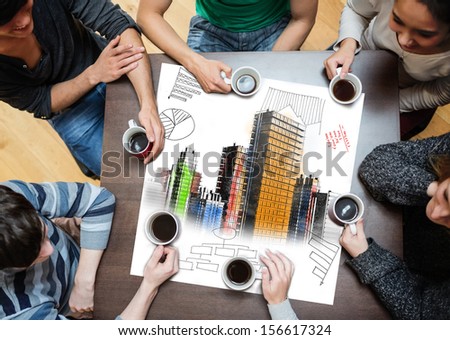 Overhead view of people sitting around table with painted city on sheet while having a cup of coffee