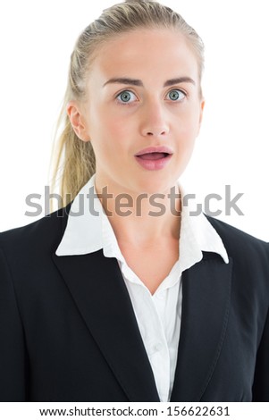 Portrait of astonished pony tailed young businesswoman on white background
