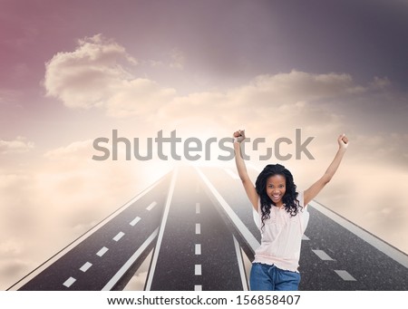 Composite image of happy woman with her arms raised up standing on in sky floating streets