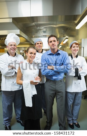 Restaurant Team Posing Together In A Kitchen