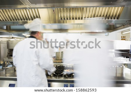 Chefs working in a kitchen at a hurried pace