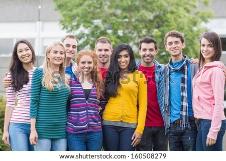 Group portrait of young college students standing in the park