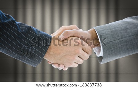 Close-up of business people handshaking