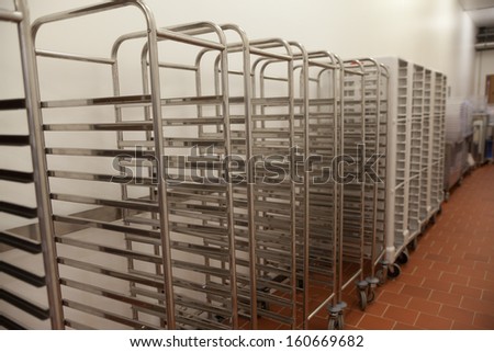 Picture of baking racks in front of wall in professional kitchen