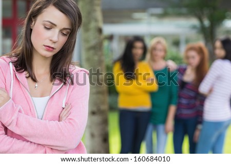 Female Student Being Bullied By Other Group Of Students